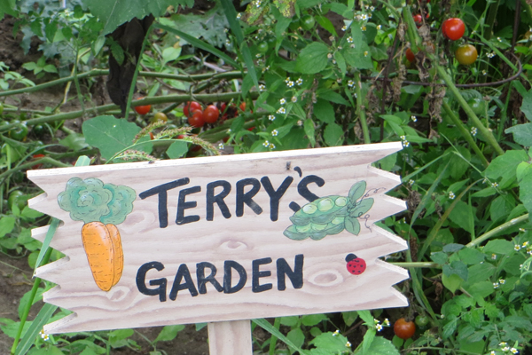 wooden sign for Terry's Garden